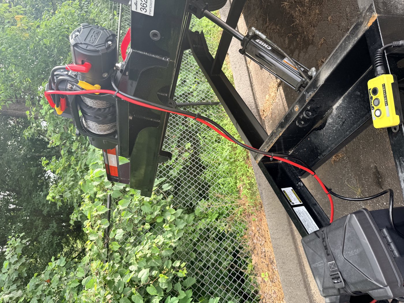 Hydraulic tilt ram, mounted winch, and the corded up and down remote control